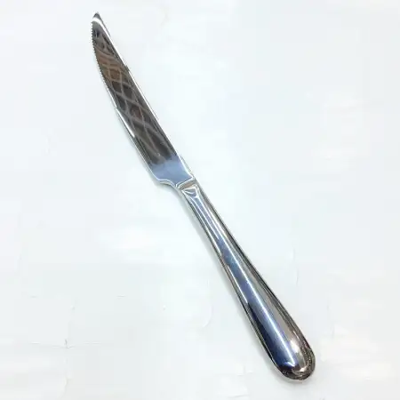 #1084-26; Stainless steel steak knife..