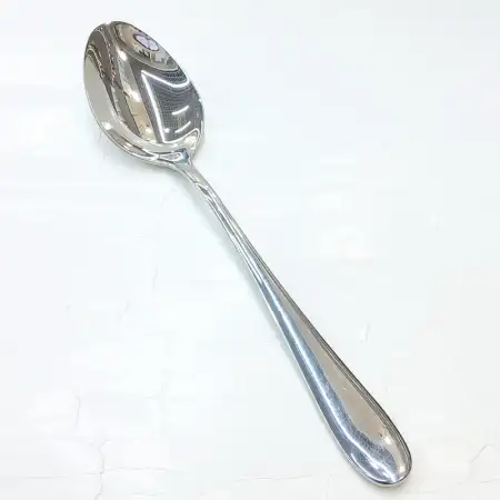 #1084B-13; Stainless steel serving spoon..